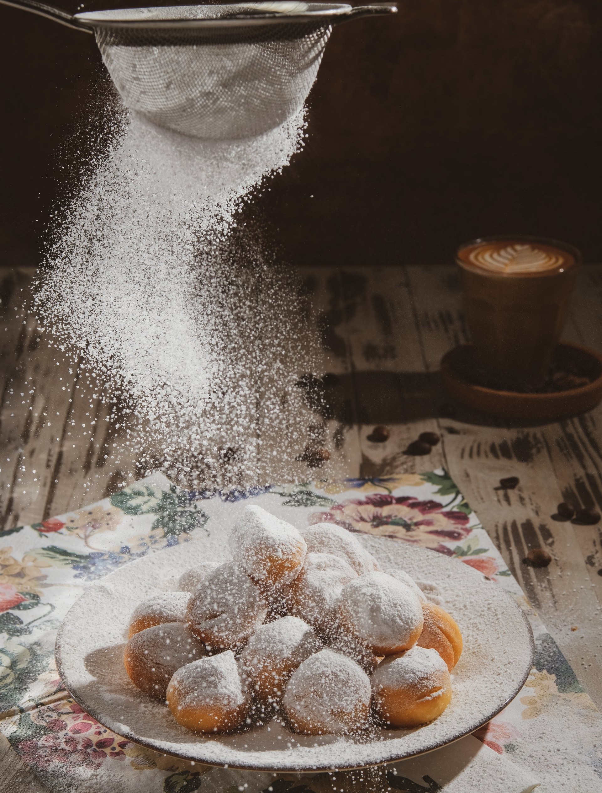 Indiana Sugars, a bulk powdered sugar supplier, powdered sugar being sifted on beignet's.