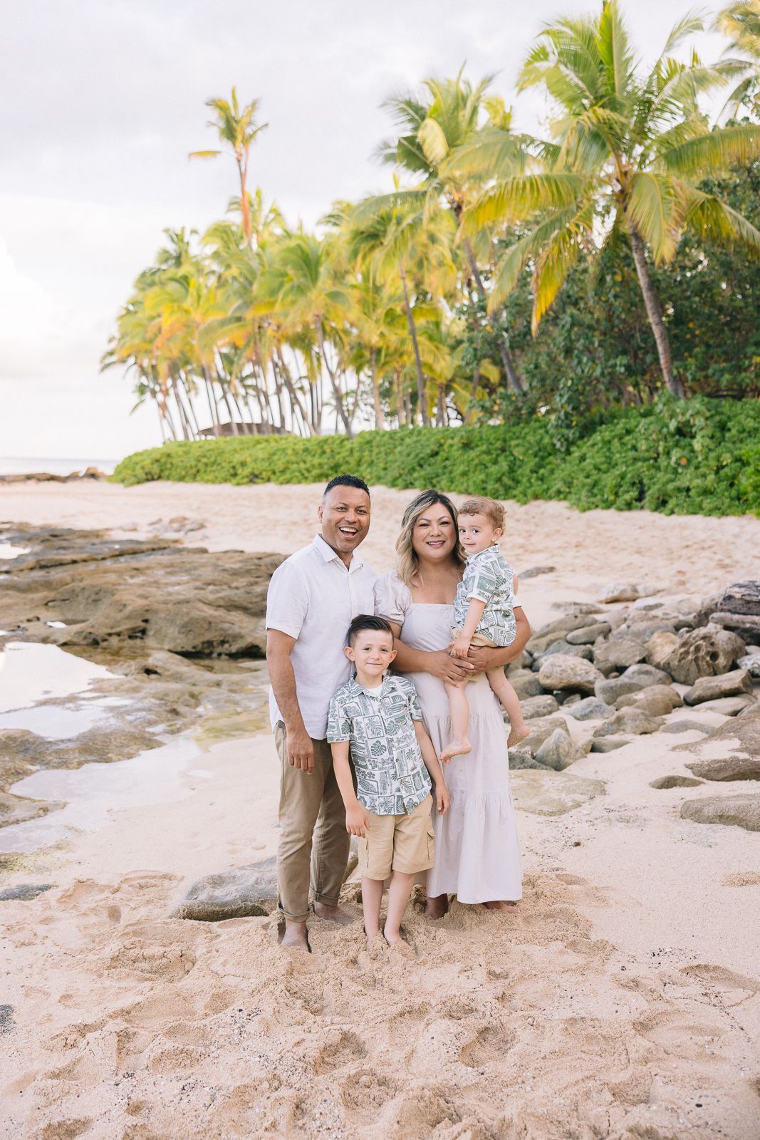 The family enjoying a beach in Hawaii
