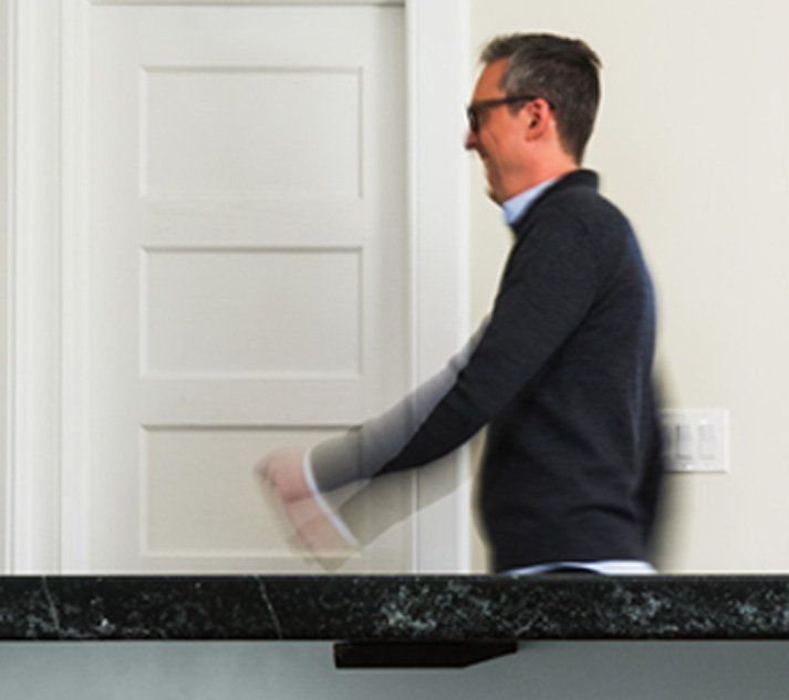 A blurry picture of a man standing in front of a door