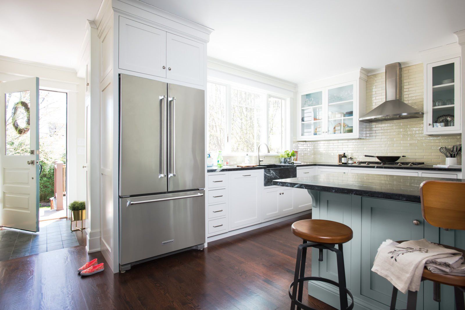 A kitchen with a stainless steel refrigerator and a stainless steel freezer.
