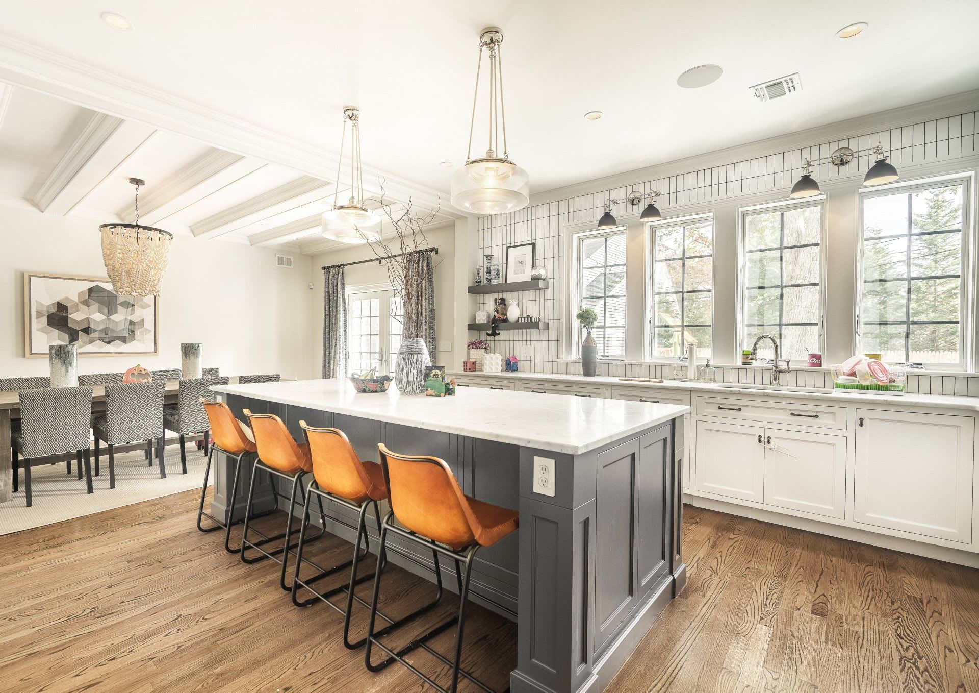 A large kitchen with a large island and stools.