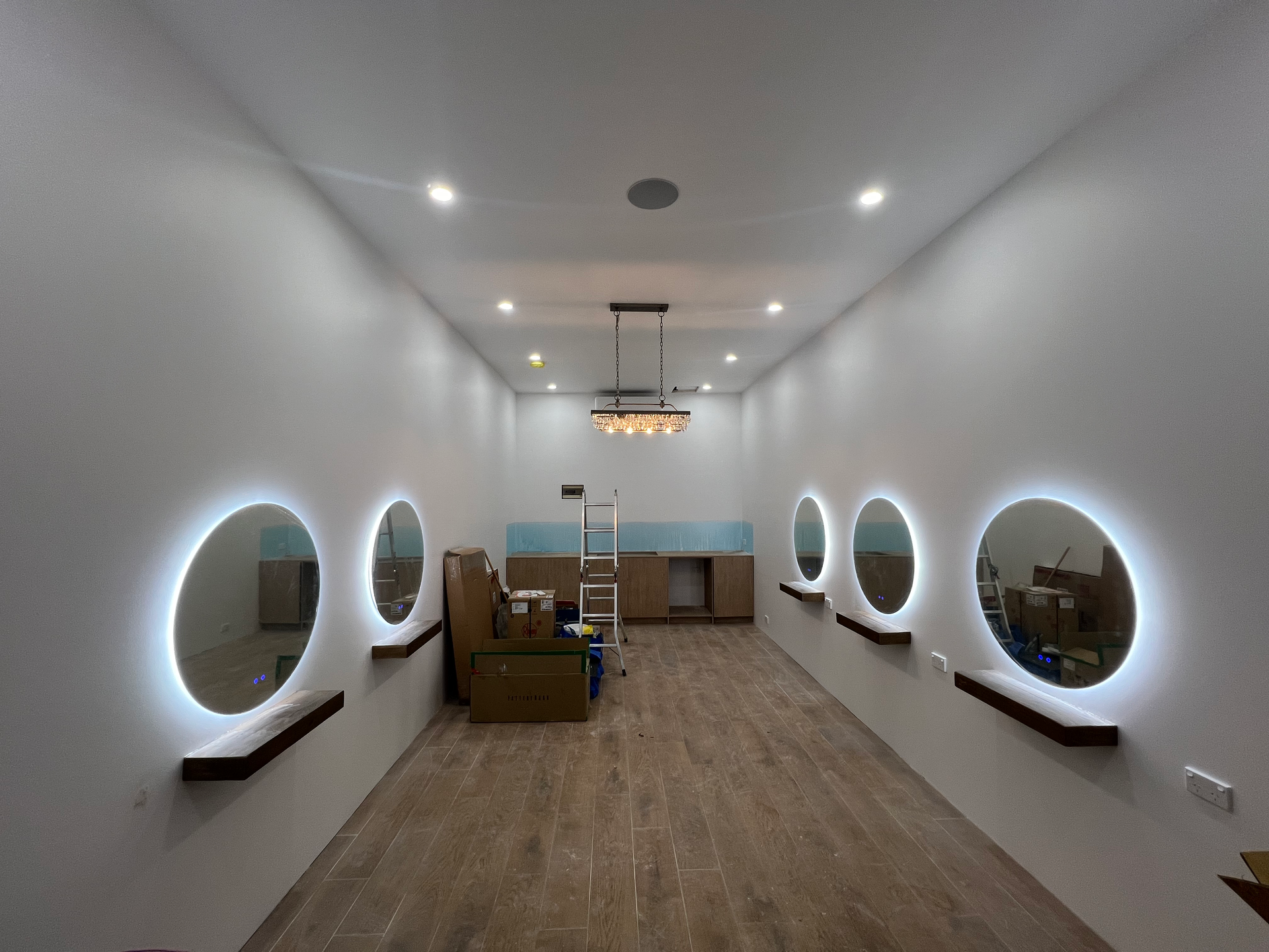 A room with a lot of mirrors on the wall