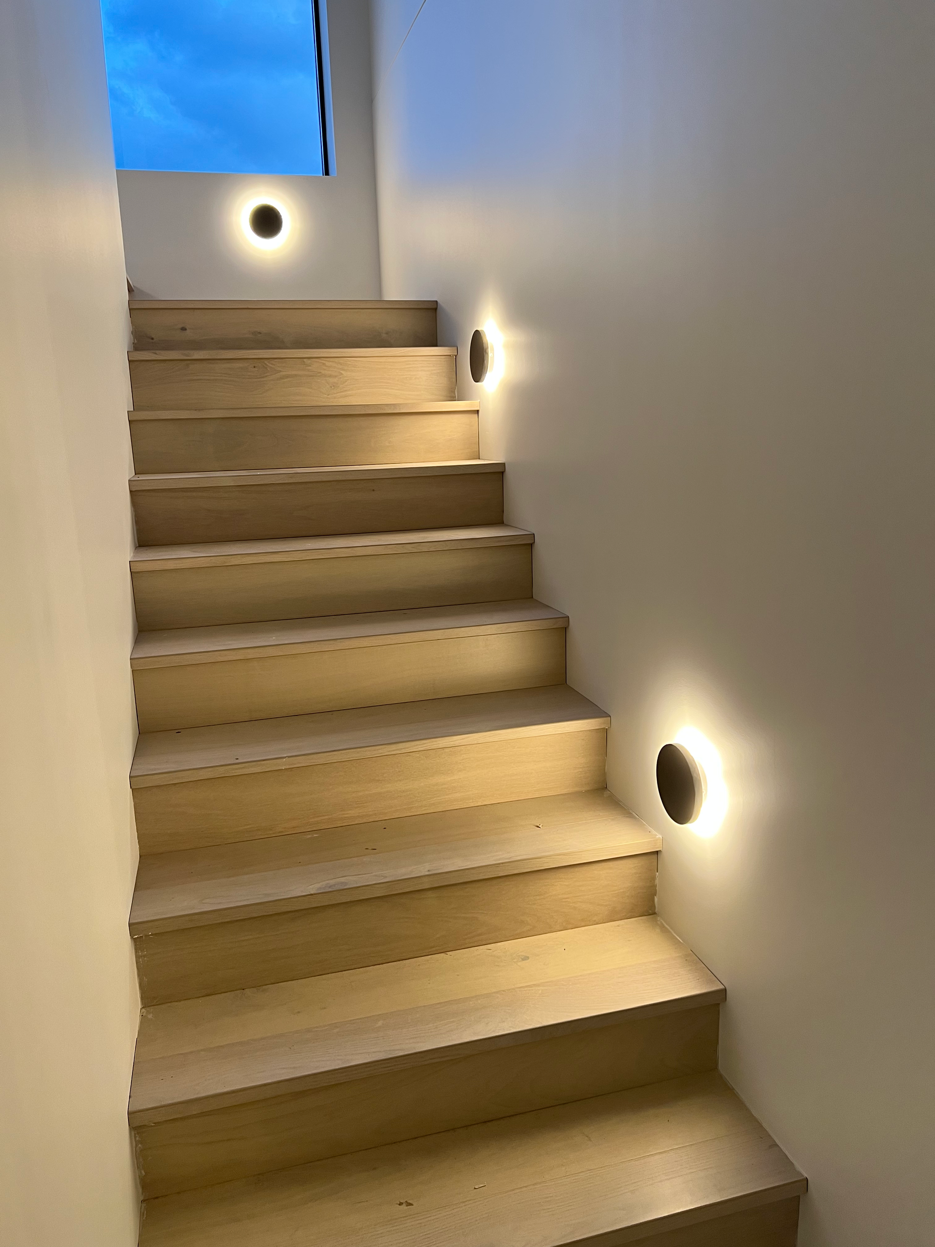 A set of stairs with lights on the steps