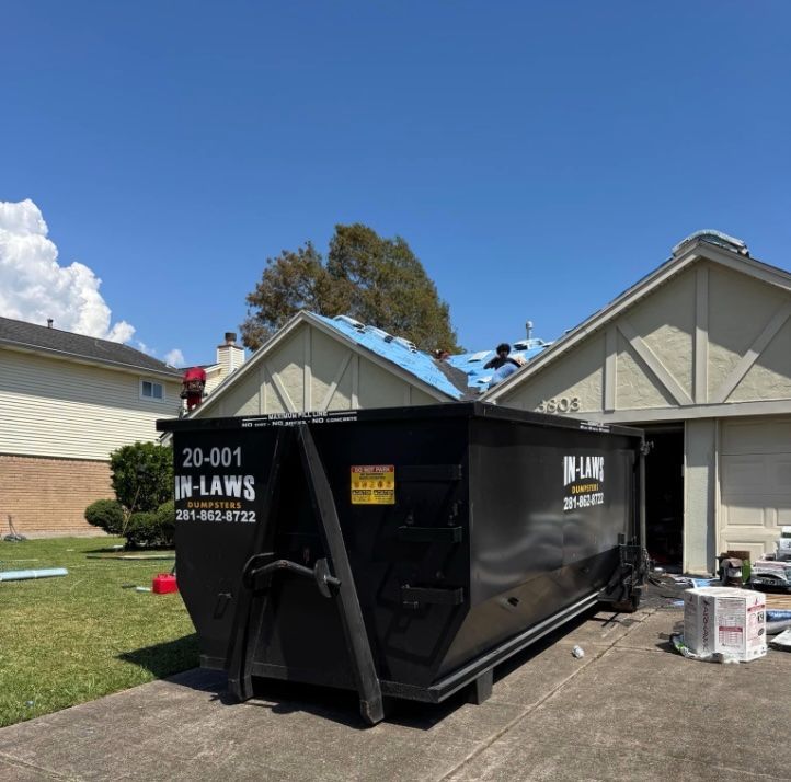 Roll-off dumpster set up for a residential roof tear-off in Houston