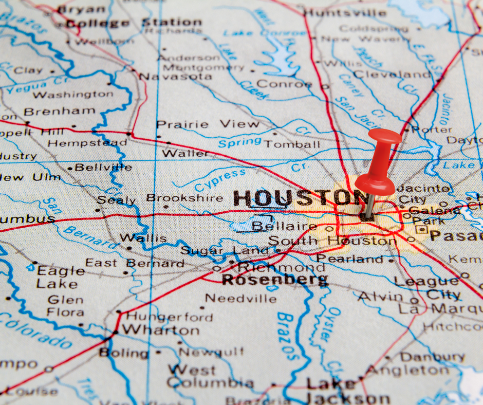 A map of houston with a red pin on it