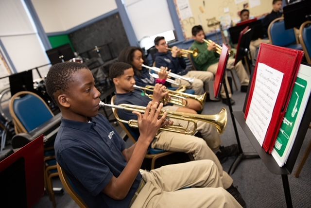 Youth playing musical instruments