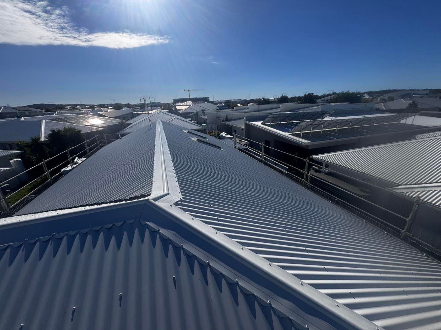 Metal Roof With Safety Railings, Sunny Day — Rumara Roofing in Sunshine Coast, QLD