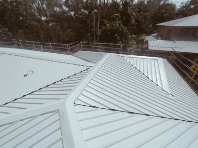 White Metal Roof With a Complex Structure, Visible Guardrails — Rumara Roofing in Sunshine Coast, QLD
