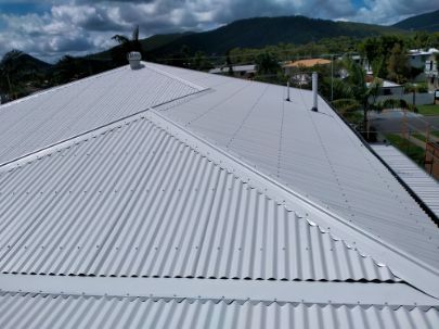 White Metal Roof on a House, Overlooking a Residential Area — Rumara Roofing in Sunshine Coast, QLD