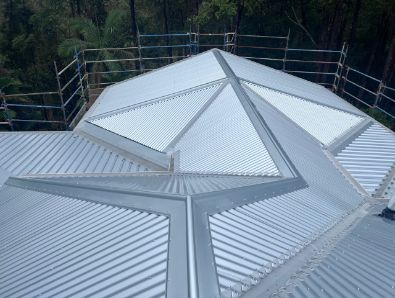 Metal Roof With Triangular Skylights; Scaffolding in Background — Rumara Roofing in Sunshine Coast, QLD