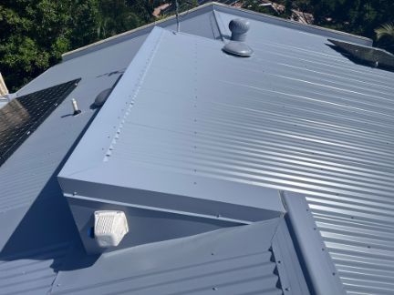 Blue Metal Roof With Vent and Solar Panels — Rumara Roofing in Sunshine Coast, QLD