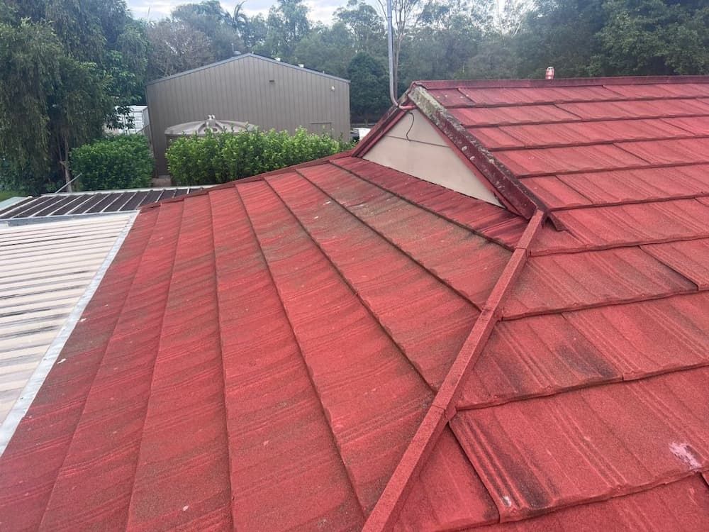 Red Tiled Roof on a House, Viewed From Above With Visible Dirt — Rumara Roofing in Sunshine Coast, QLD