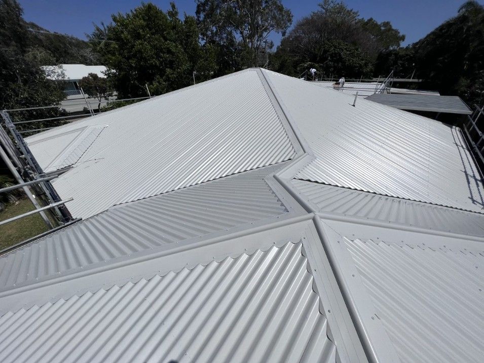 White Corrugated Metal Roof of a House With Ridges and Seams — Rumara Roofing in Sunshine Coast, QLD