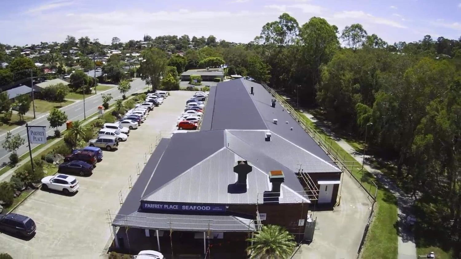Aerial View of the Bargo Hotel in Bargo, Australia, With a Car Park and Trees — Rumara Roofing in Sunshine Coast, QLD