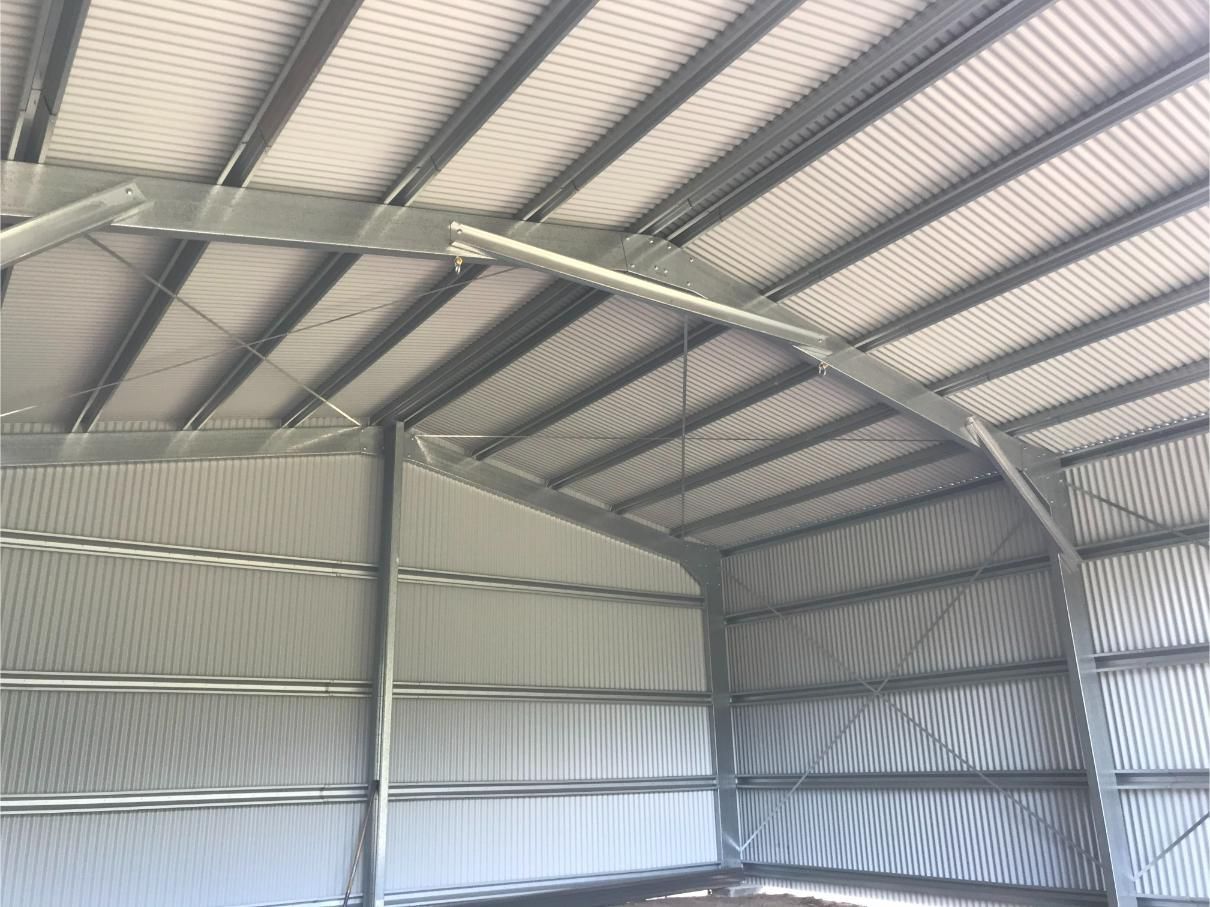Interior View of a Steel-framed Building With Corrugated Metal Walls and Arched Roof Supports — Bridgey's Constructions in Wallabi Point, NSW