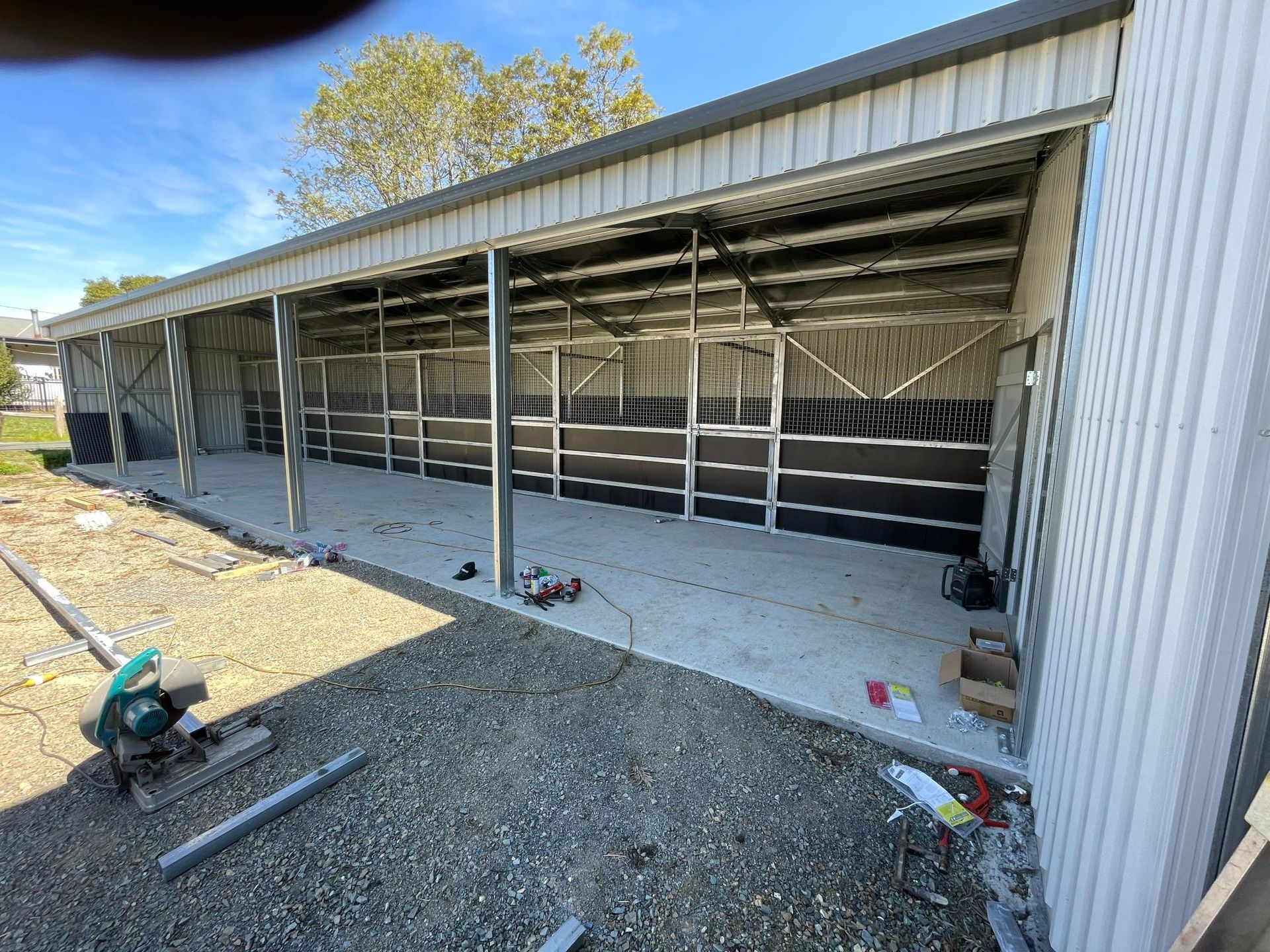 Shed Under Construction with Gravel Foreground and Scattered Materials — Bridgey's Constructions in Wallabi Point, NSW