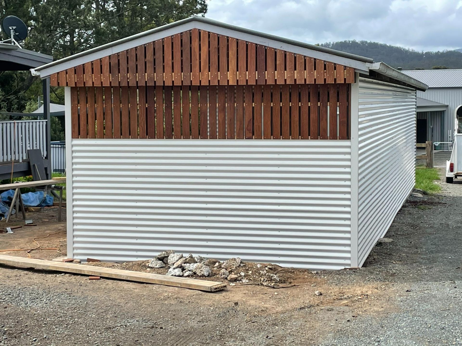 Small Corrugated Metal Shed with A Wooden Gable End — Bridgey's Constructions in Wallabi Point, NSW