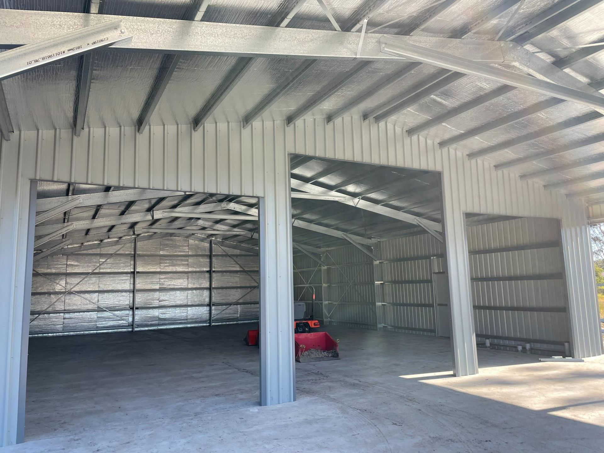 Interior of A Large Metal Workshop with Open Bays — Bridgey's Constructions in Wallabi Point, NSW
