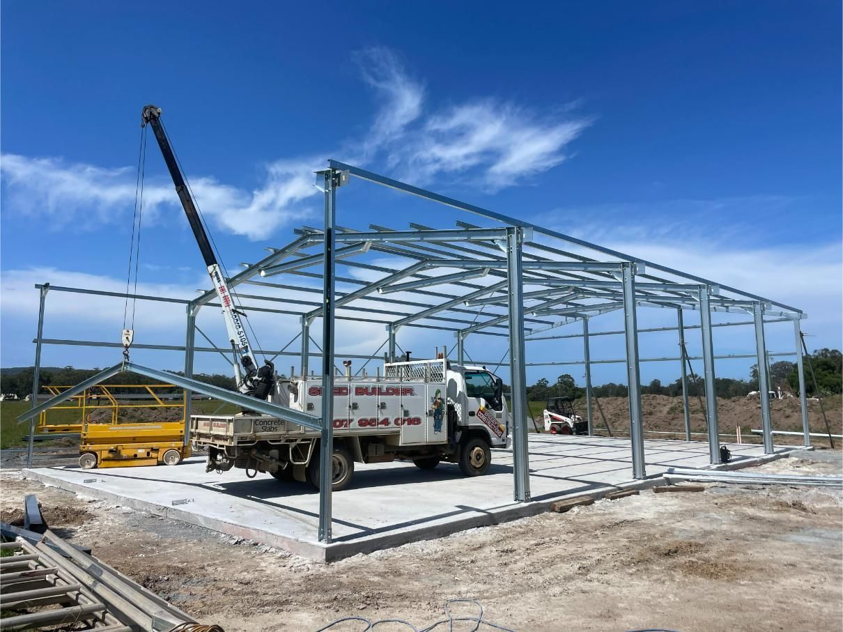 Steel Building Frame Under Construction with Crane — Bridgey's Constructions in Wallabi Point, NSW