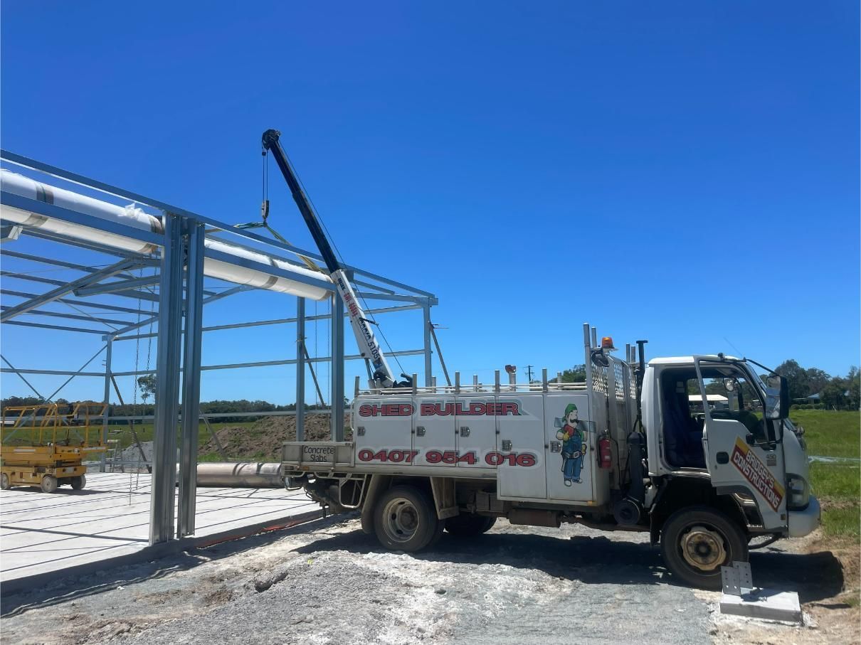 Tow Truck Lifting a Steel Building Frame on A Construction Site — Bridgey's Constructions in Wallabi Point, NSW