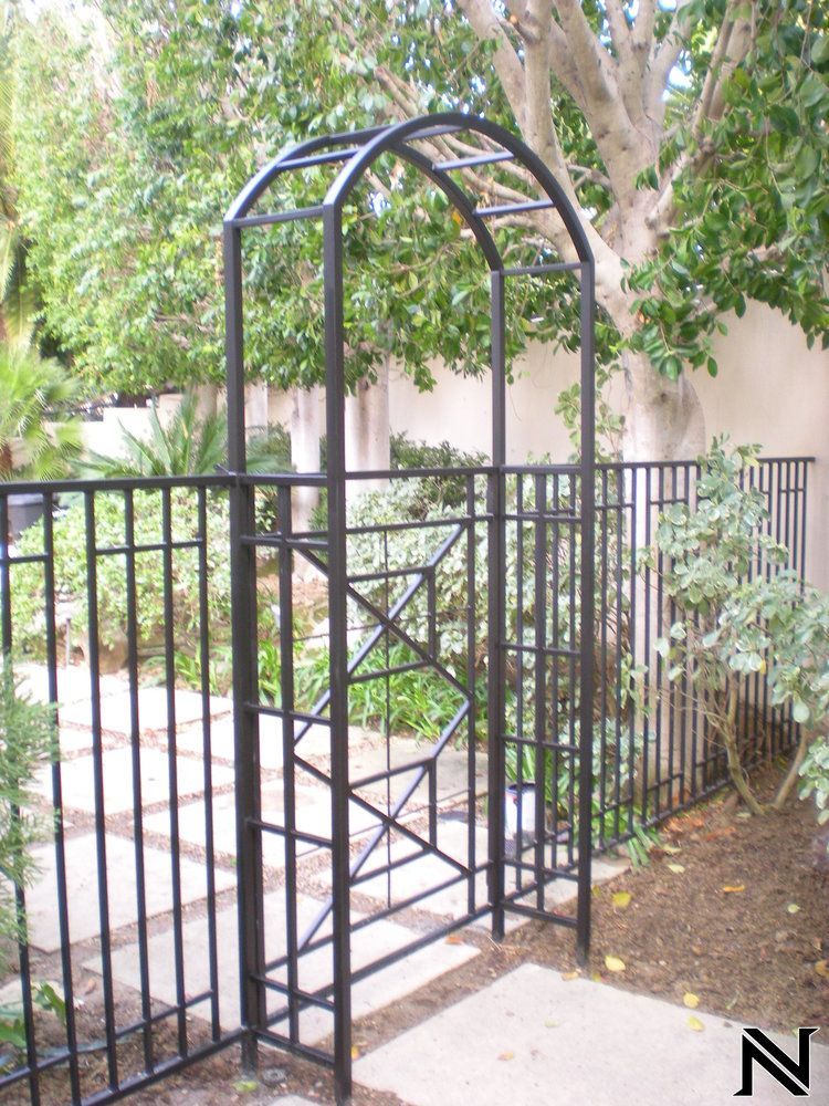 A wrought iron gate with the letter n on it