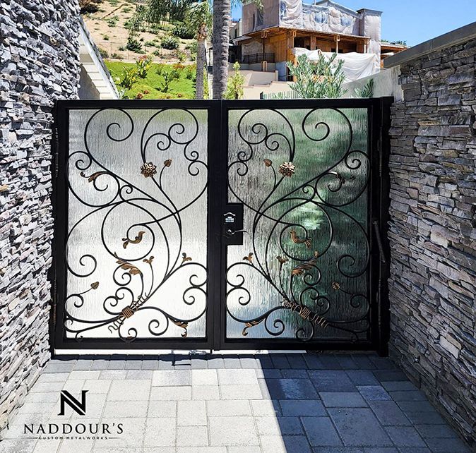 A wrought iron gate with the letter n on it