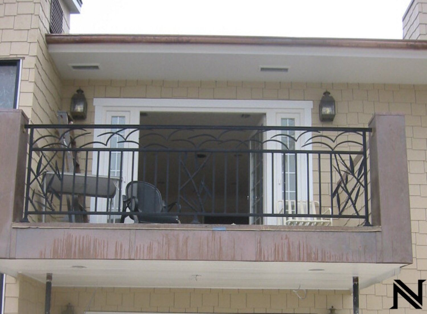 A balcony with the letter n on the bottom right