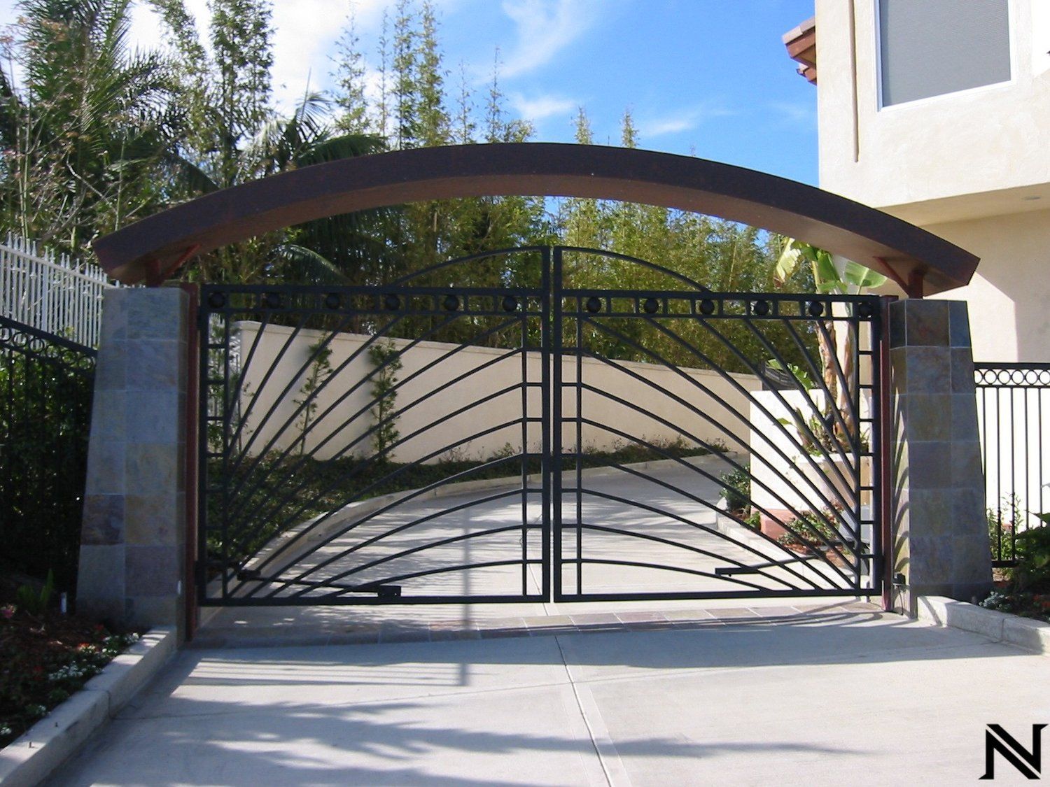 A wrought iron gate with the letter n on it