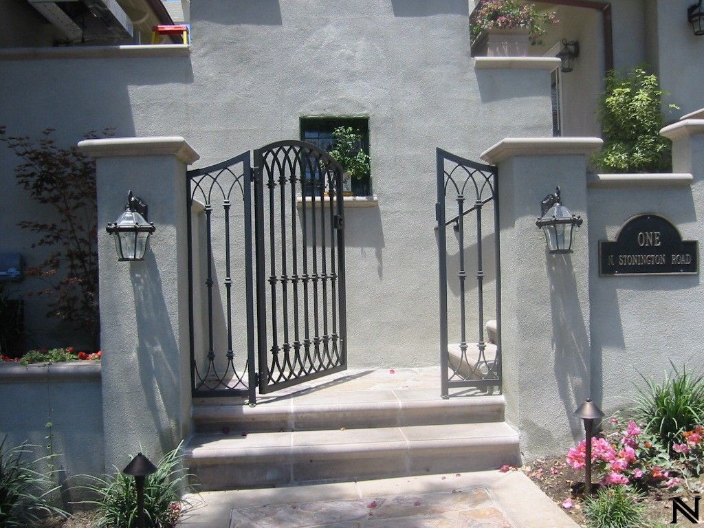 A wrought iron gate with the number 158 on it