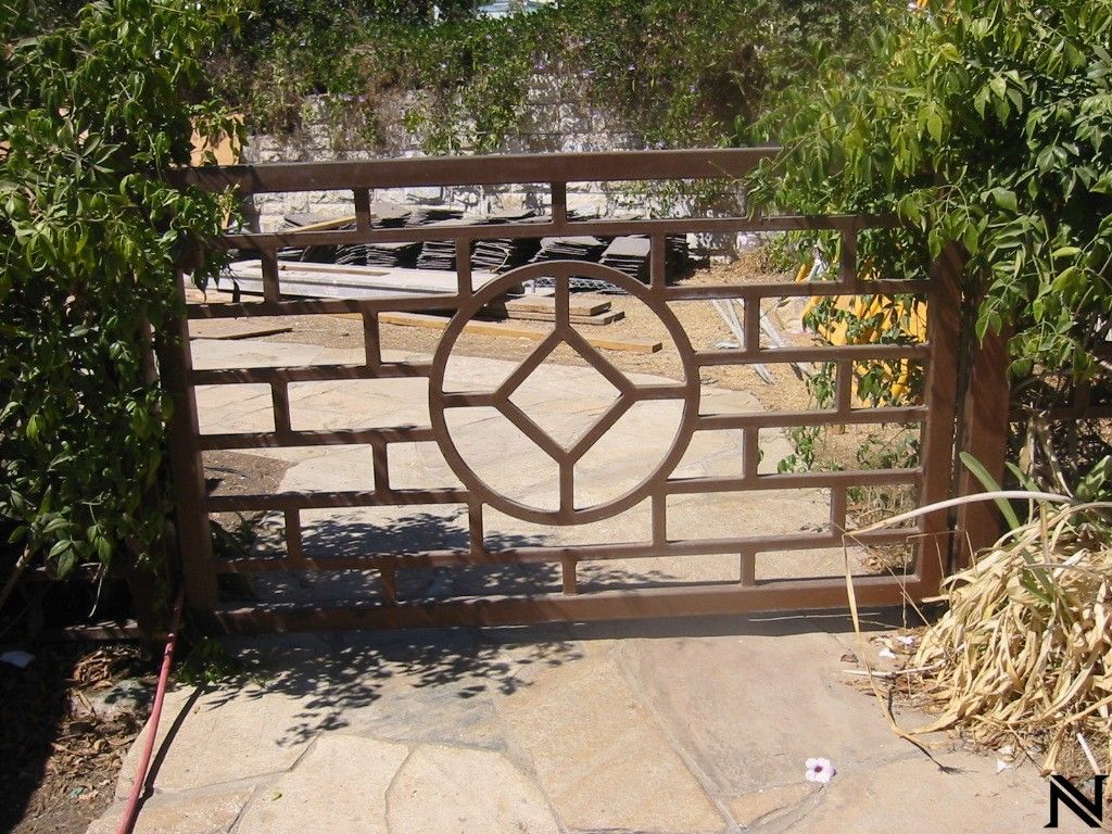A gate with a diamond in the middle of it