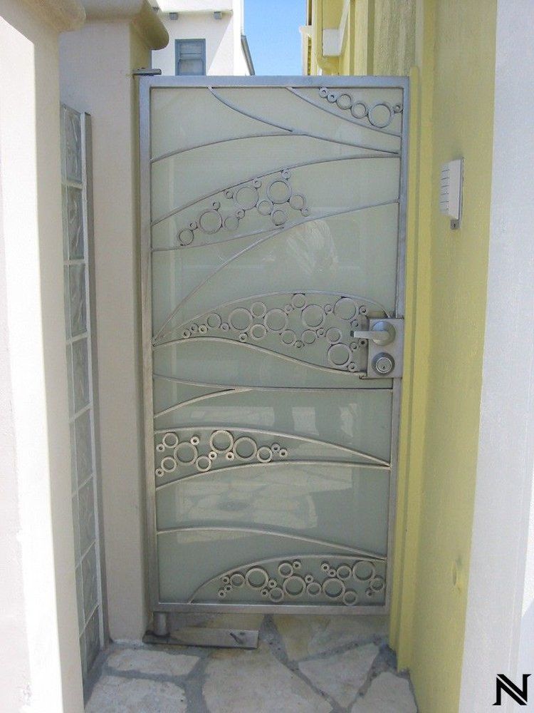 A stainless steel gate with the letter n on it