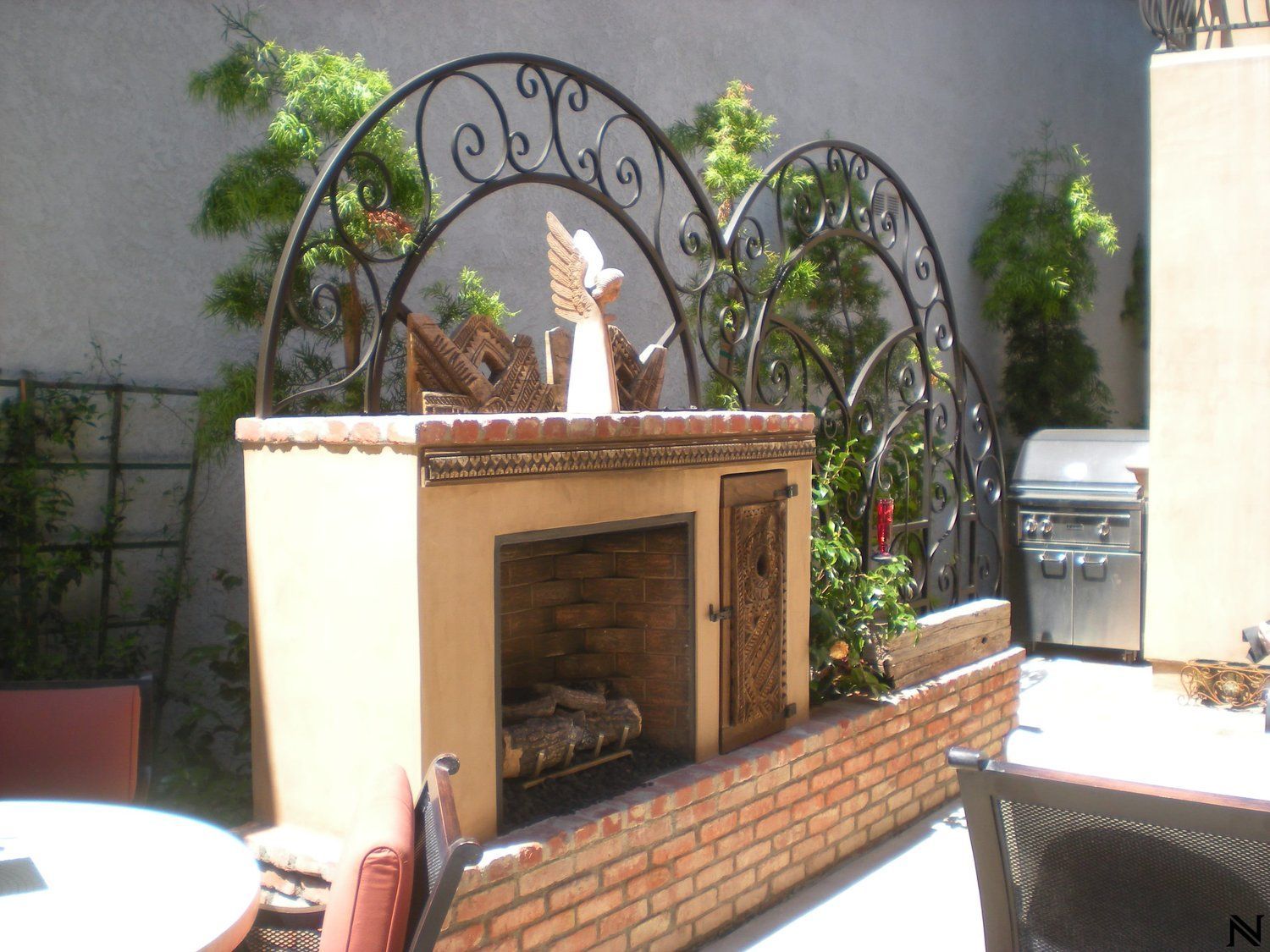 A fireplace with a statue of an angel on top of it