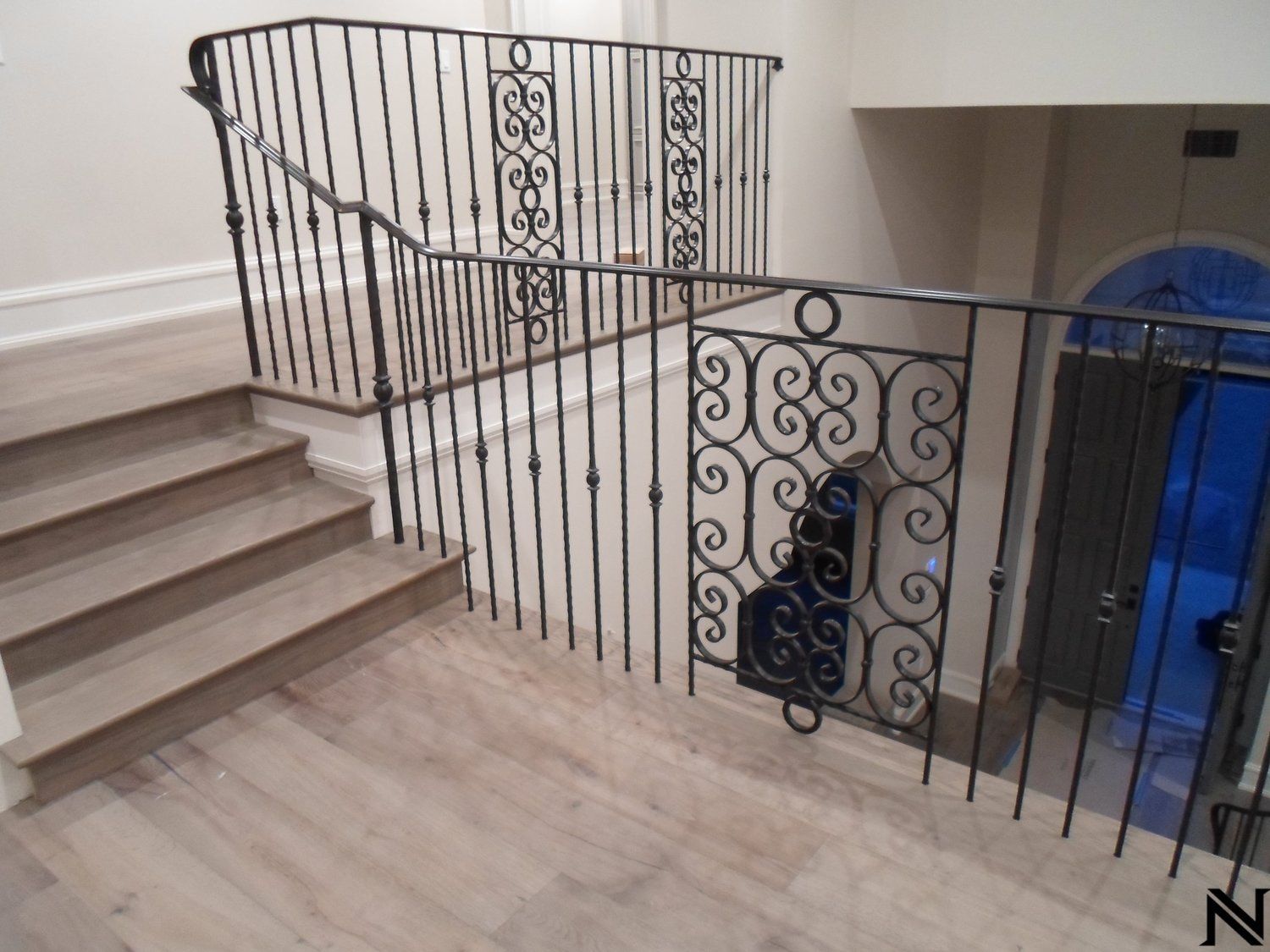 A wrought iron railing on a set of stairs