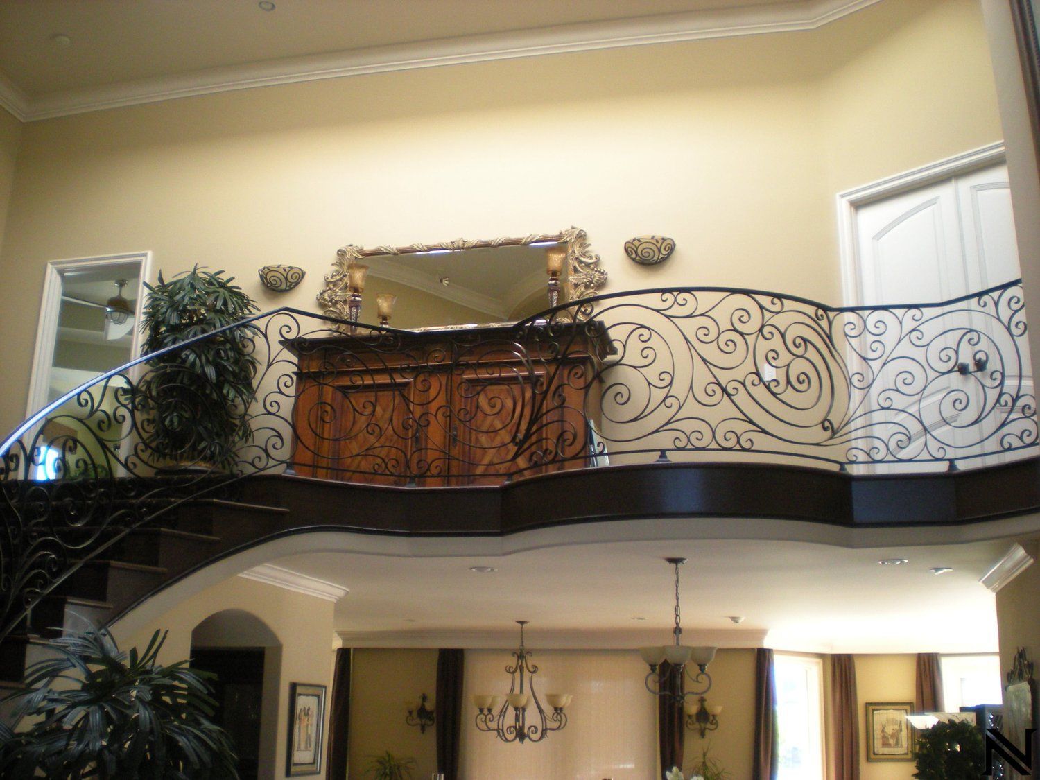 A balcony with a wrought iron railing in a house