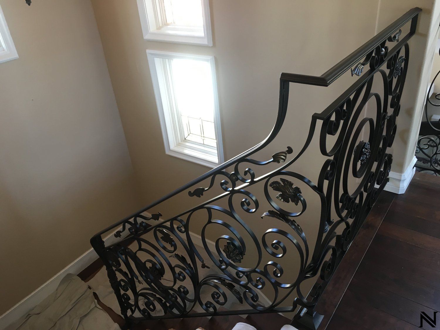 A wrought iron railing on a staircase in a house