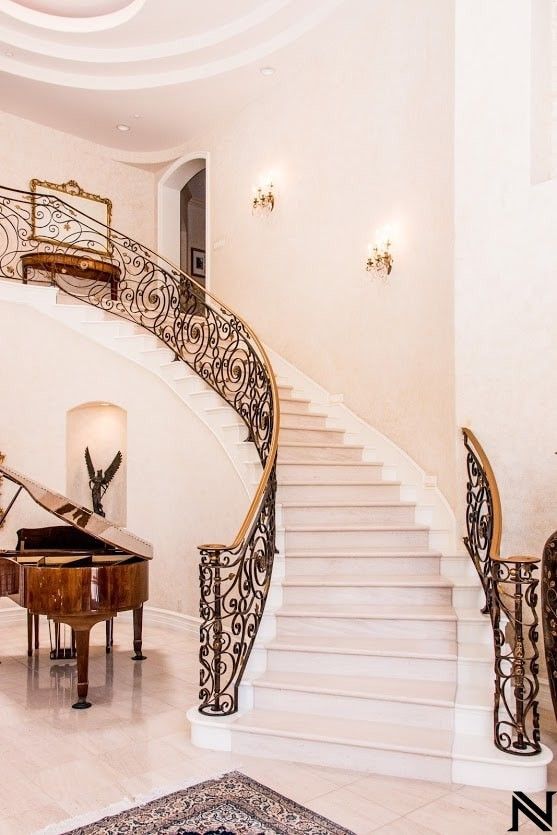 There is a piano in the middle of the stairs.
