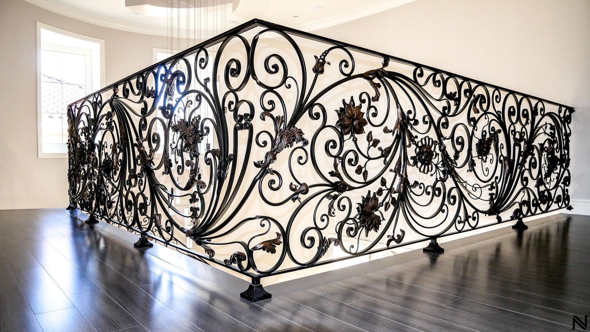 A wrought iron railing on a staircase in a house