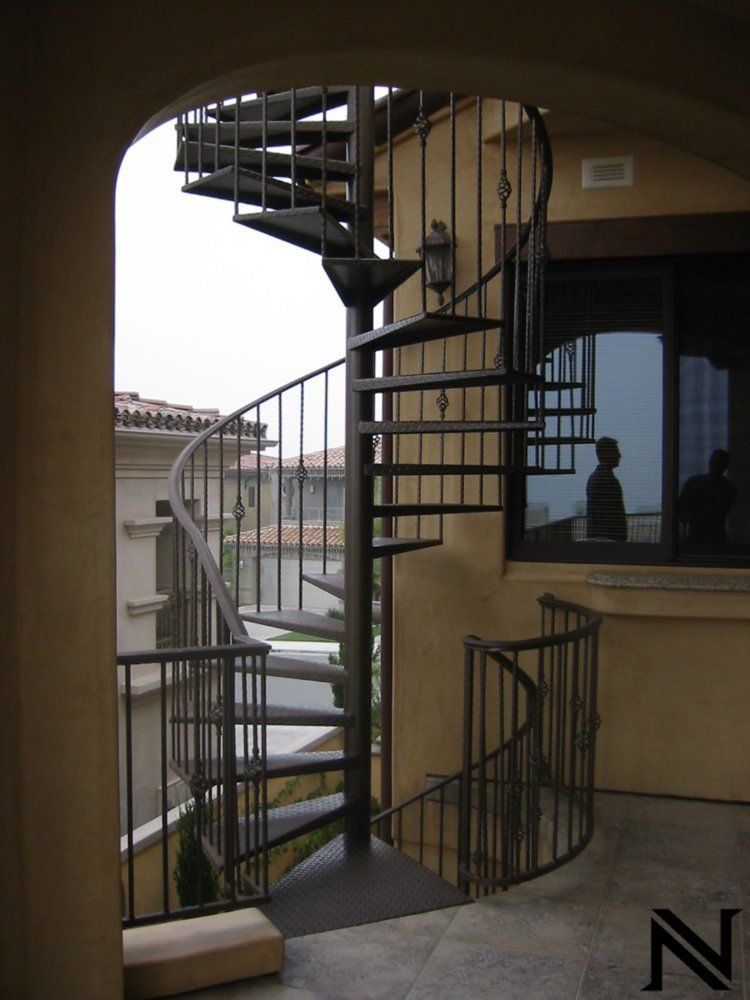 A spiral staircase with the letter n in the corner