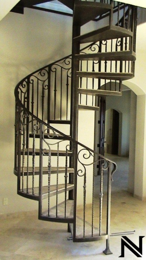 A spiral staircase with the letter n on the bottom
