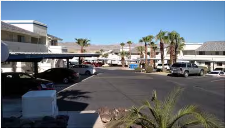 A lot of cars are parked in a parking lot