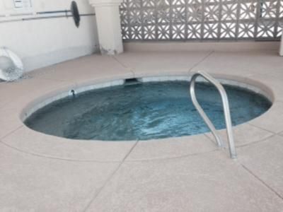 A hot tub with a staircase leading to it