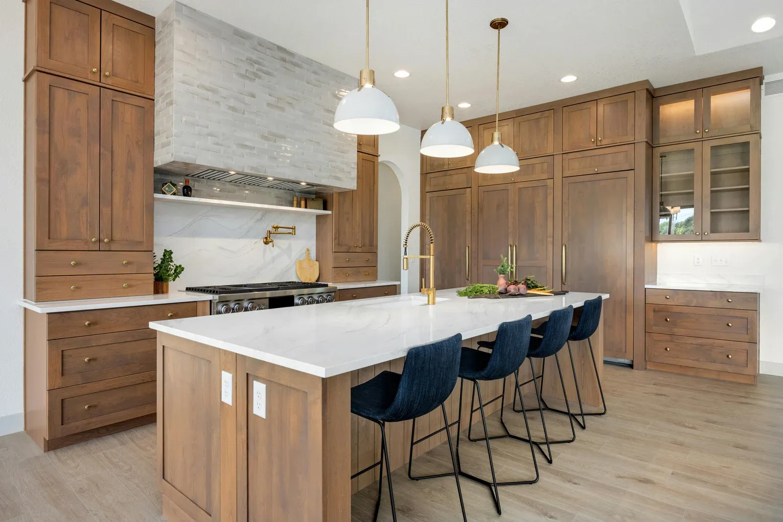 A kitchen with wooden cabinets and stainless steel appliances.