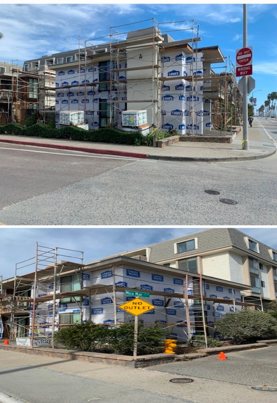 Apartment building under construction at a street corner, with scaffolding, road signs, and traffic cones.