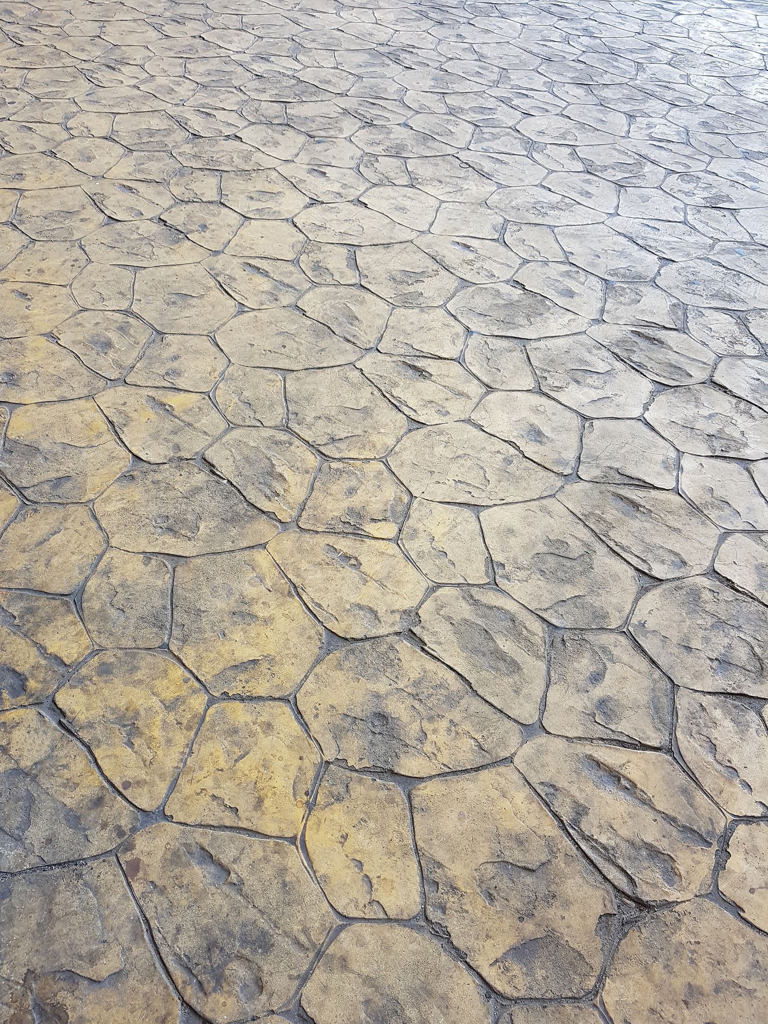 Pedestrian walkway concrete mold stamping design.