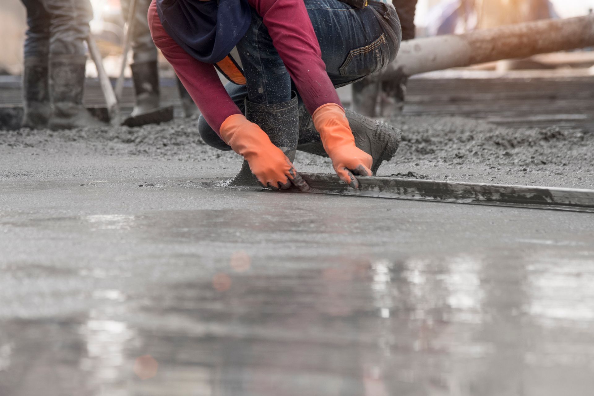 Construction Worker Troweling Wet Concrete On A Top Of Concrete Floor Slab New Construction Site