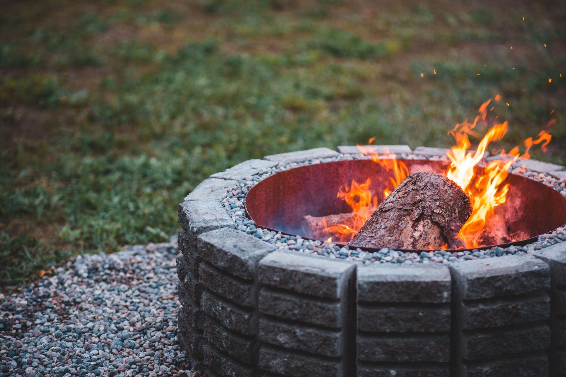 Custom gas fire pit surrounded by patio seating at a Lutherville, Maryland home