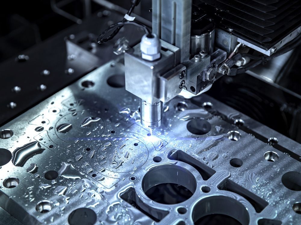 A Machine is Cutting a Piece of Metal in a Factory — NQBC Pty Ltd in Bowen, QLD