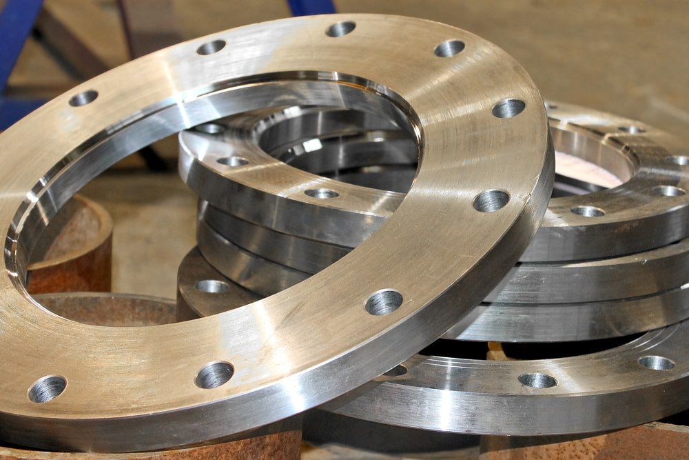 A Bunch of Metal Rings Are Stacked on Top of Each Other — NQBC Pty Ltd in Ayr, QLD