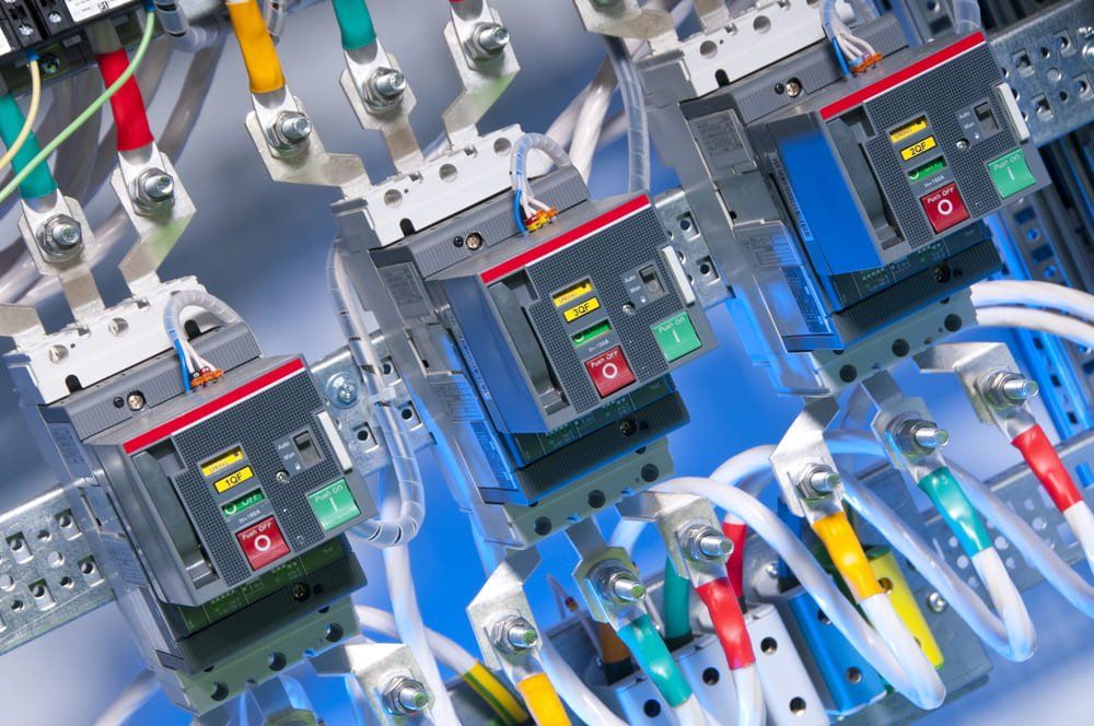 A Close Up of a Bunch of Electrical Equipment on a Table — NQBC Pty Ltd in Collinsville, QLD