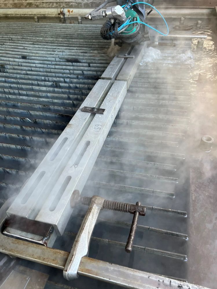 A Person is Cutting a Piece of Metal With a Machine — NQBC Pty Ltd in Collinsville, QLD